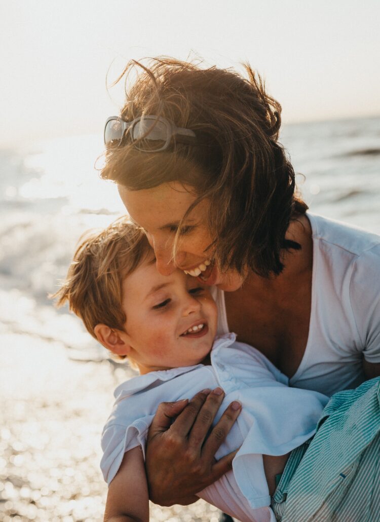 Mother and son playing at beach