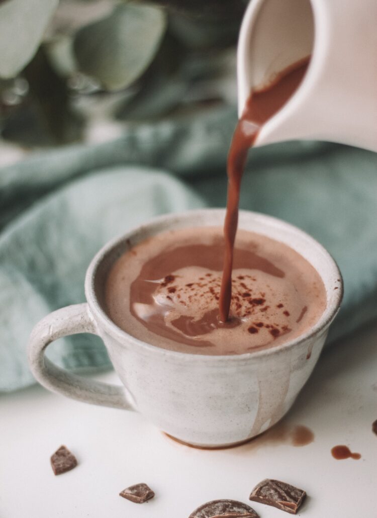 hot chocolate being poured and spilling