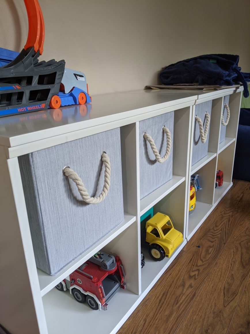 Playroom toy storage shelves and bins